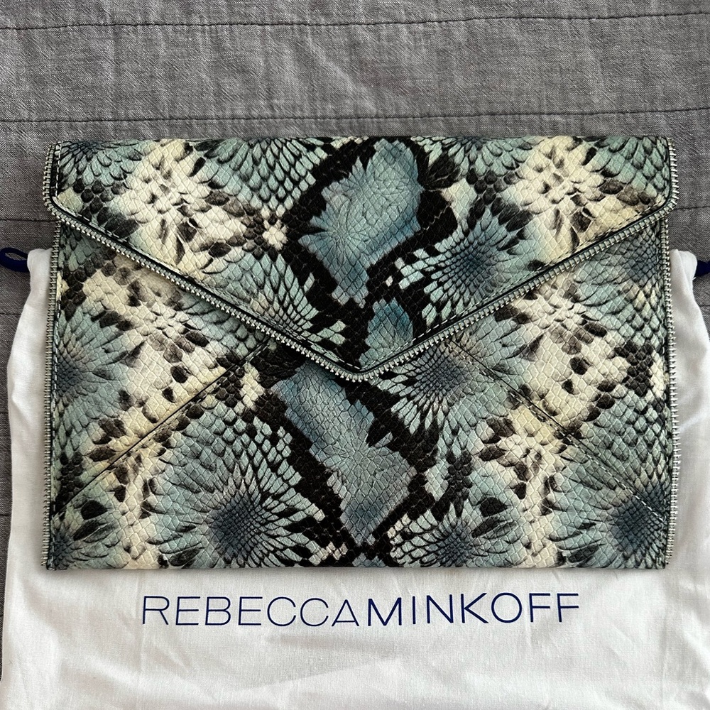 Rebecca Minkoff leather snake skin clutch with zipper detail with tags.